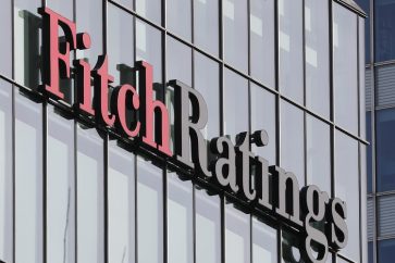 The Fitch Ratings logo is seen at their offices at Canary Wharf financial district in London